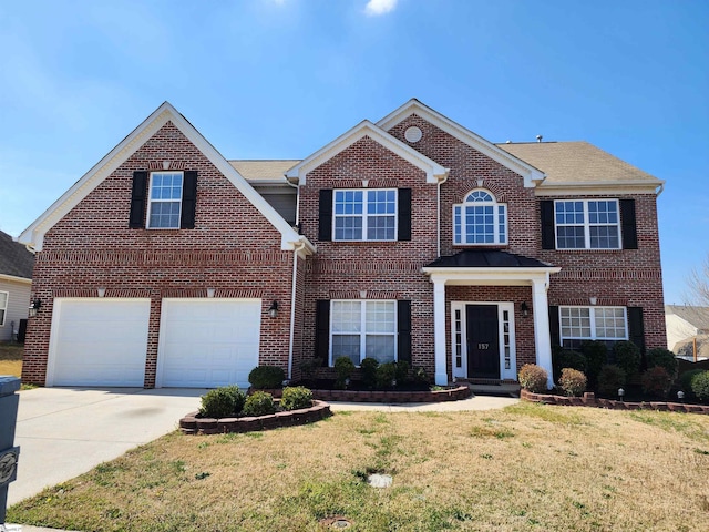view of front of property with a front lawn, brick siding, and concrete driveway