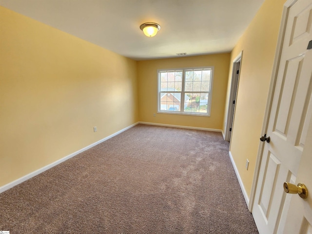 unfurnished bedroom with baseboards, visible vents, and carpet floors