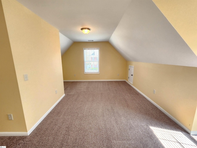 bonus room featuring carpet floors, lofted ceiling, and baseboards