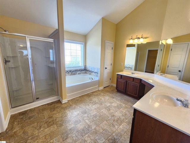 bathroom with a shower stall, lofted ceiling, a sink, and a closet
