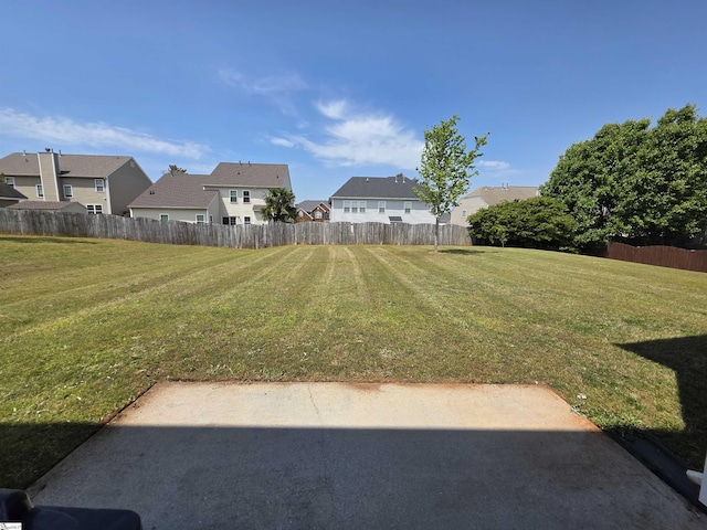 view of yard with fence and a residential view