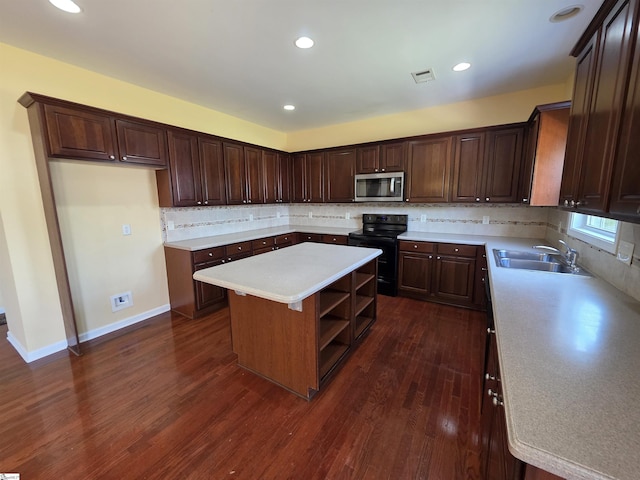 kitchen with a center island, dark wood-style floors, a sink, stainless steel microwave, and black range with electric stovetop