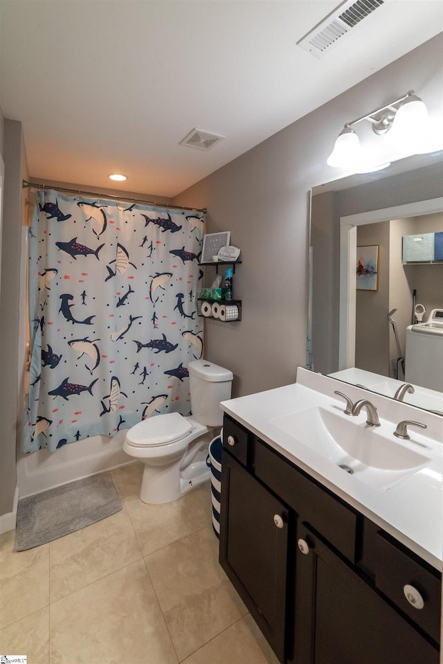 bathroom featuring washer / dryer, toilet, visible vents, and tile patterned floors