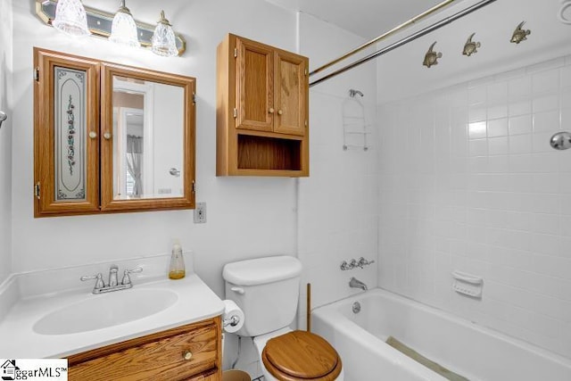 bathroom featuring shower / bath combination, toilet, and vanity