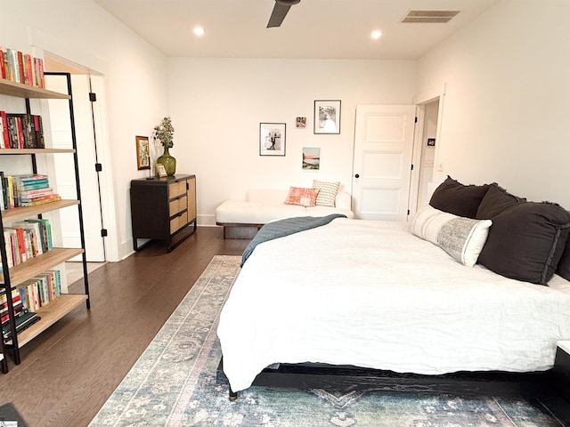 bedroom with dark wood-type flooring, recessed lighting, visible vents, and baseboards