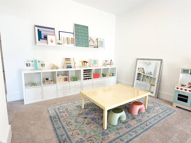 playroom with baseboards and carpet