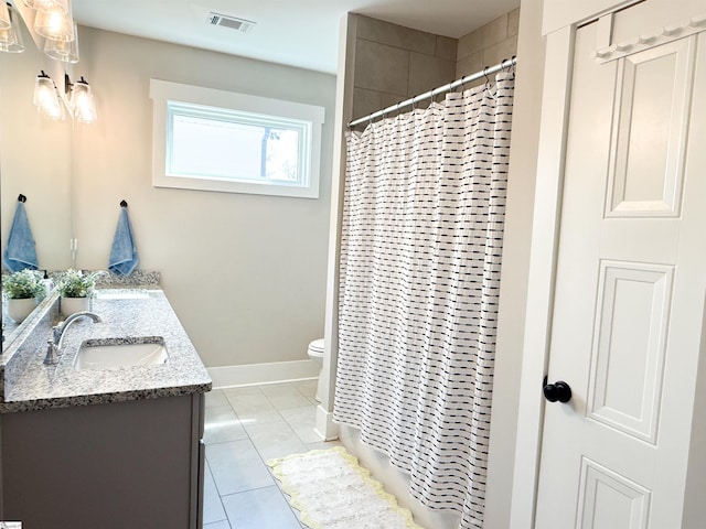 full bathroom with a sink, visible vents, toilet, and tile patterned floors