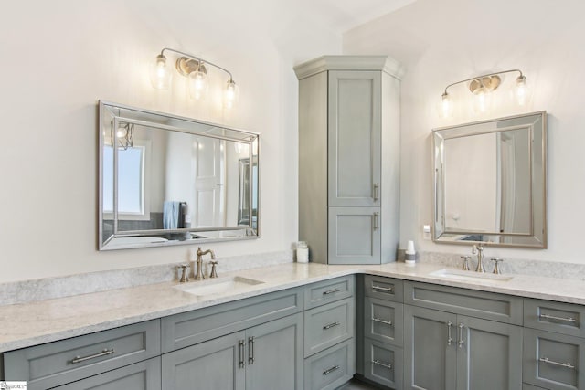 bathroom featuring double vanity and a sink