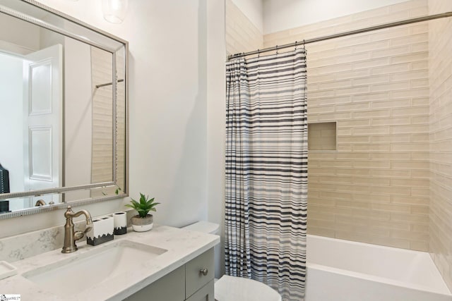 full bathroom featuring shower / bath combo with shower curtain, toilet, and vanity