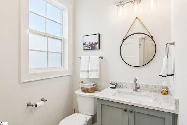 half bath with toilet and vanity