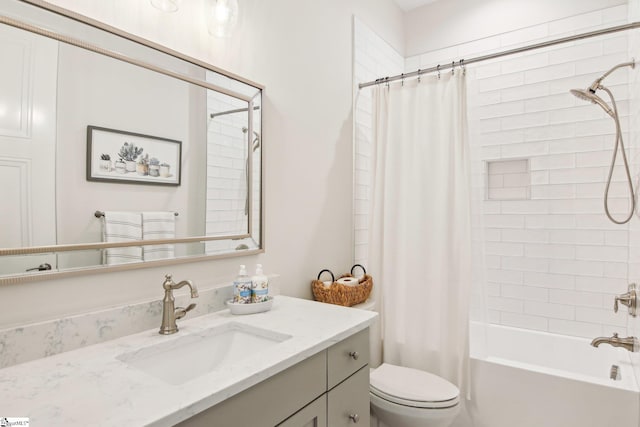 full bathroom featuring toilet, vanity, and shower / bath combo