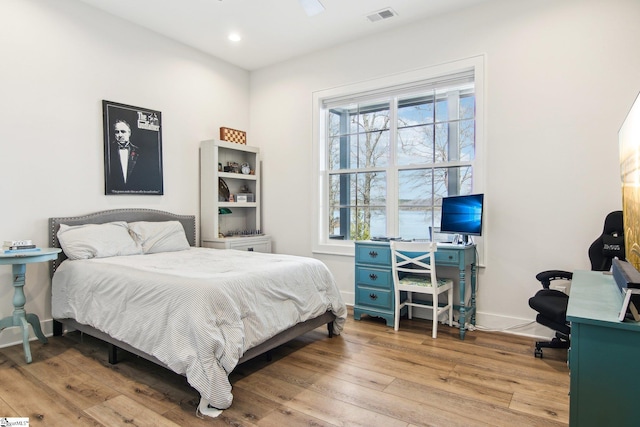 bedroom featuring recessed lighting, visible vents, baseboards, and light wood-style floors