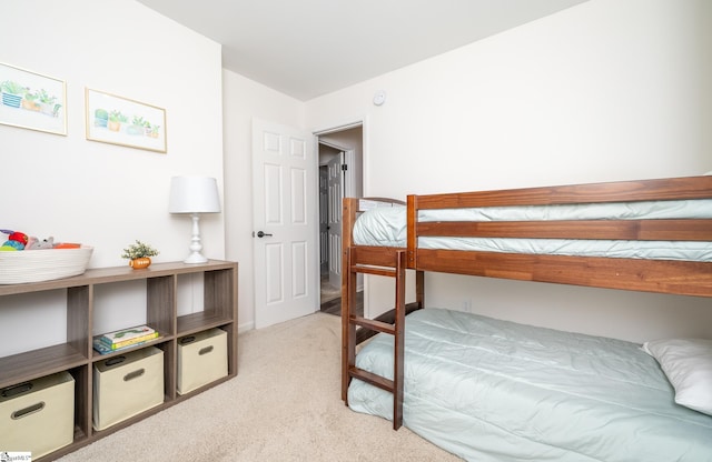 bedroom featuring light colored carpet