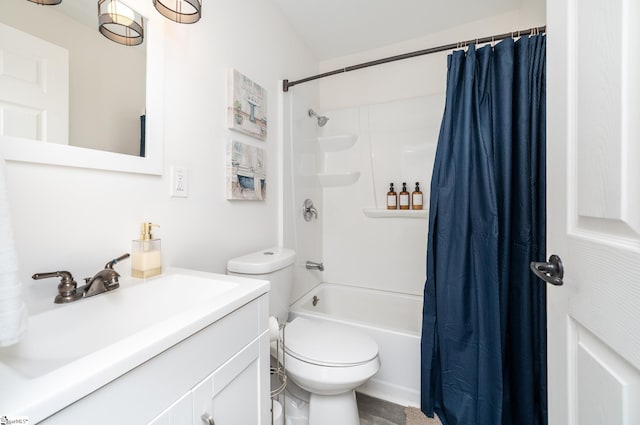 bathroom featuring toilet, vanity, and shower / bath combo