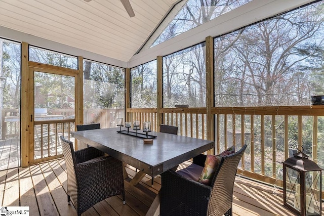 sunroom featuring a ceiling fan and vaulted ceiling