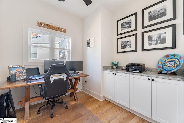 office space featuring light wood finished floors and baseboards