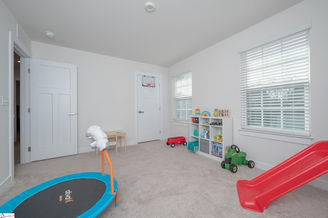 game room with carpet and baseboards