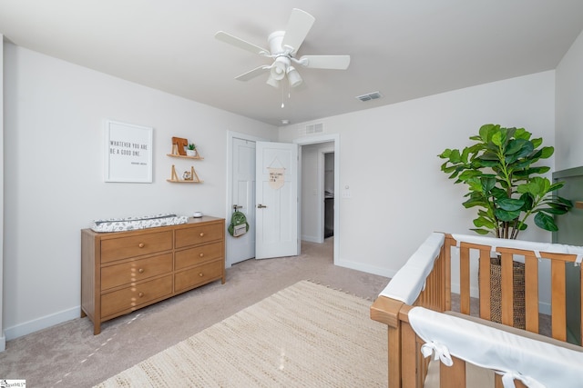 bedroom with light carpet, visible vents, ceiling fan, and baseboards