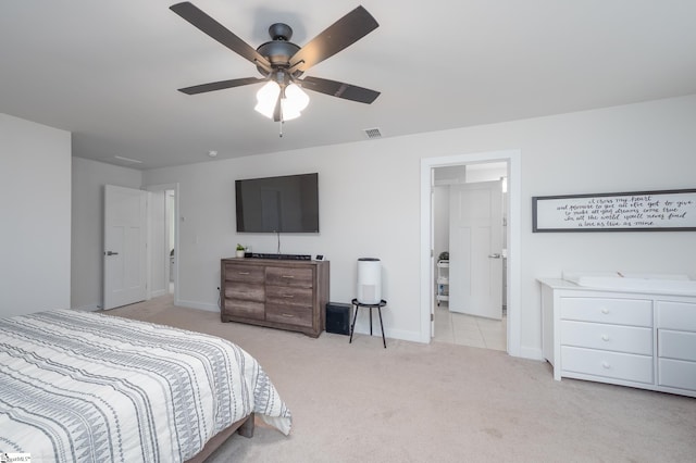 carpeted bedroom with visible vents, a ceiling fan, and baseboards