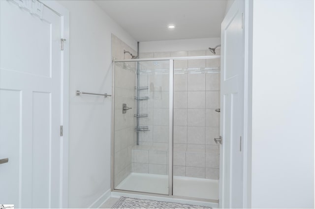 full bath featuring a shower stall