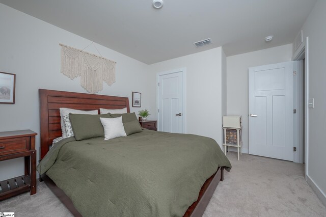 bedroom featuring visible vents and carpet flooring