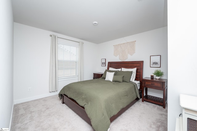 bedroom featuring baseboards and carpet floors