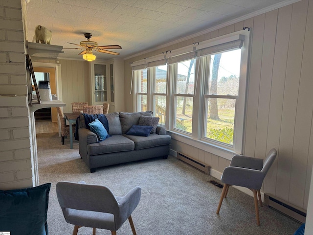 living room featuring a baseboard radiator and ornamental molding