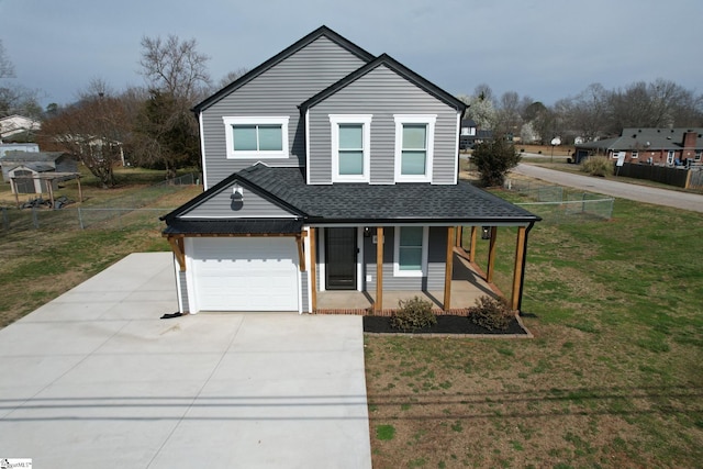 traditional-style home featuring driveway, a front lawn, fence, covered porch, and roof with shingles