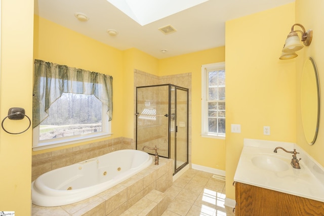 bathroom with tile patterned flooring, visible vents, a shower stall, a jetted tub, and vanity