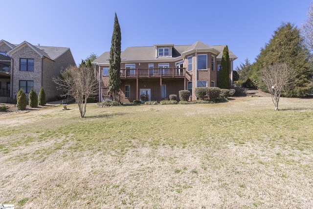 back of house with a deck and a lawn