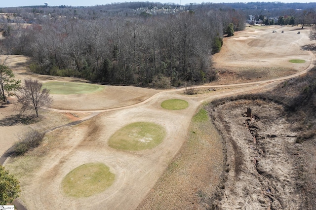 drone / aerial view featuring a forest view