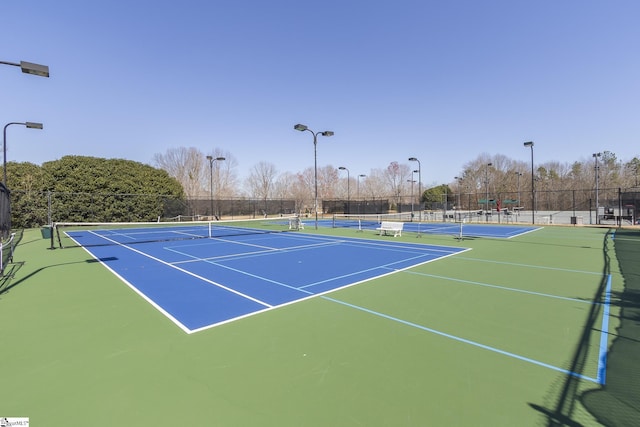 view of sport court with community basketball court and fence