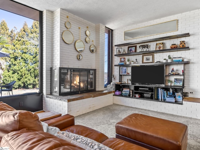 145 Dickson Rd, Campobello, SC 29322 - living area with a fireplace, brick wall, and a textured ceiling