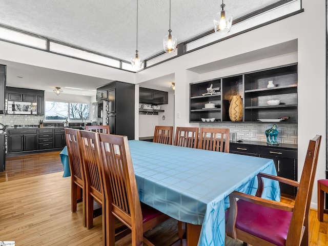 145 Dickson Rd, Campobello, SC 29322 - dining room with a textured ceiling and light wood-style floors