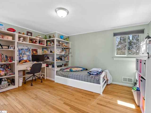 145 Dickson Rd, Campobello, SC 29322 - bedroom featuring visible vents, baseboards, wood finished floors, and ornamental molding