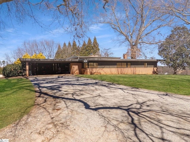 145 Dickson Rd, Campobello, SC 29322 - mid-century home featuring a carport, driveway, and a front lawn