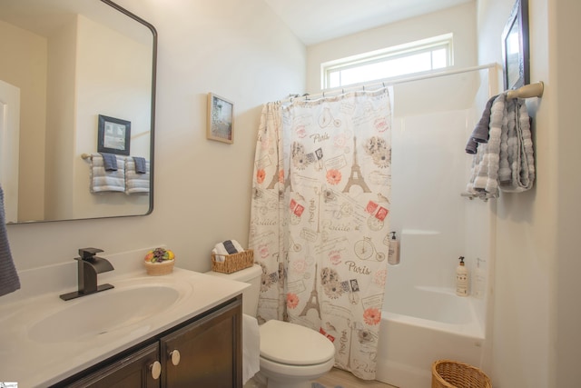 bathroom featuring shower / bath combo with shower curtain, toilet, and vanity