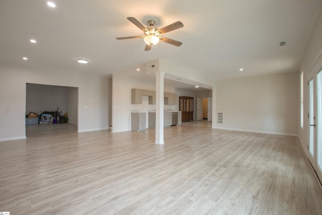 unfurnished living room with visible vents, baseboards, ceiling fan, and light wood finished floors