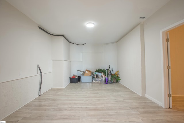 interior space with visible vents and wood finished floors