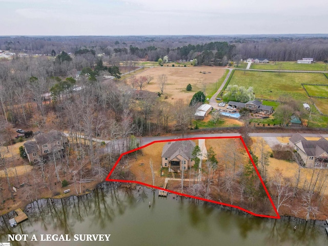 bird's eye view featuring a wooded view, a rural view, and a water view