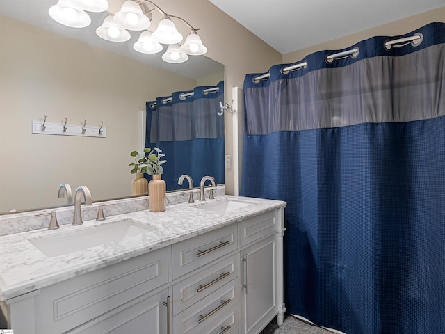 full bath featuring double vanity and a sink