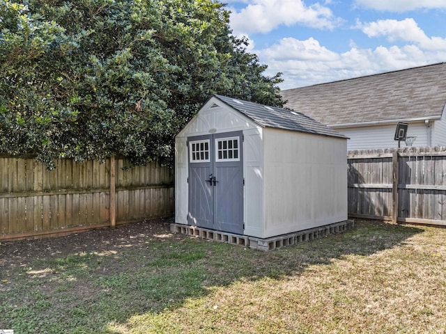 view of shed featuring a fenced backyard