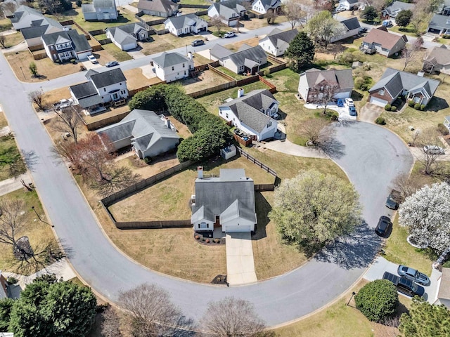 birds eye view of property with a residential view