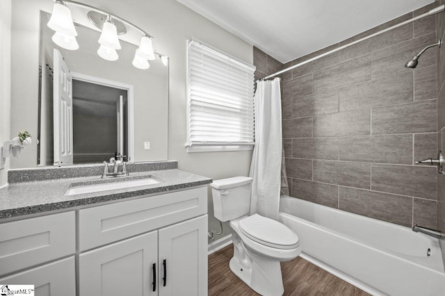 full bathroom with vanity, toilet, wood finished floors, and shower / tub combo with curtain