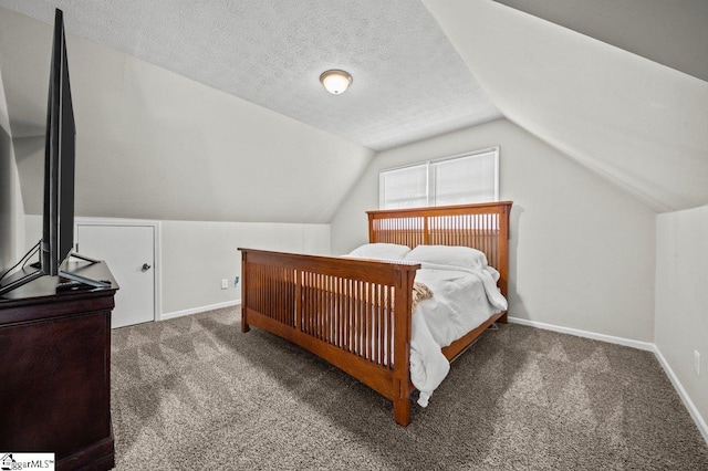 bedroom with baseboards, carpet floors, and a textured ceiling