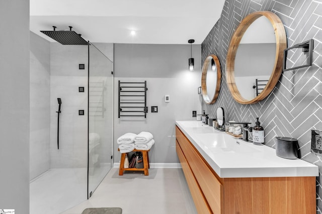 bathroom with double vanity, an enclosed shower, backsplash, and a sink