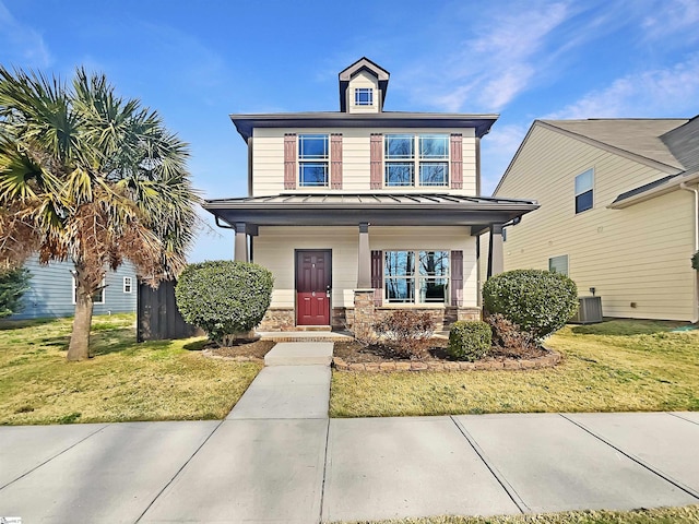 6 Ellis Mill St, Simpsonville, SC 29680 - view of front of home featuring a standing seam roof, stone siding, a porch, a front yard, and metal roof