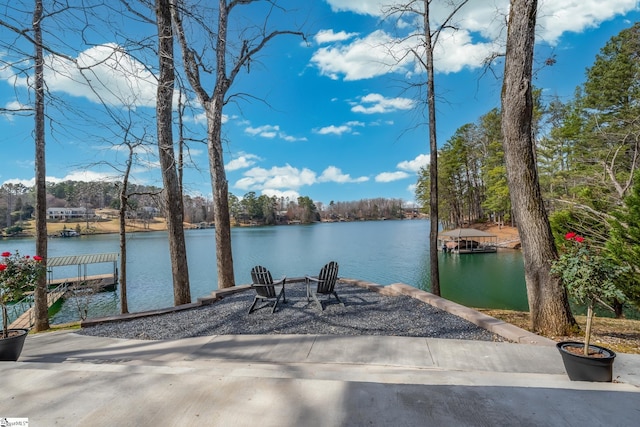 exterior space with a water view and a boat dock