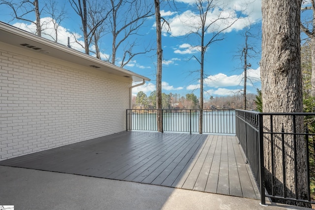 wooden deck with a water view