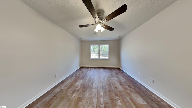 20 Woodbine Ct, Spartanburg, SC 29307 - unfurnished room featuring baseboards, a textured ceiling, a ceiling fan, and wood finished floors